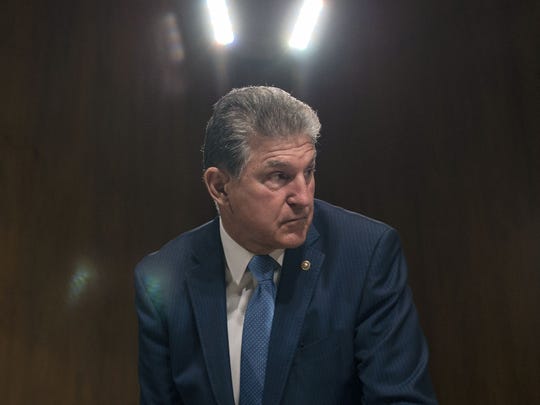 Sen. Joe Manchin, D-W.Va., looks on before the arrival