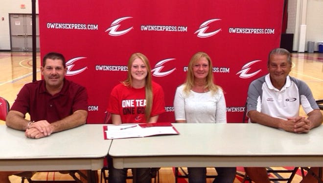 Genoa graduate Haley Pickard, second from left, will continue her basketball career at Owens Community College. Pickard is joined by father, Mike, mother, Sue, and Comets coach Mike DeStazio, right.
