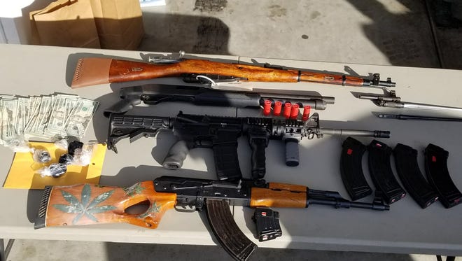 Guns, cash and possible heroin taken from a Coachella home on Jan. 12, 2018.