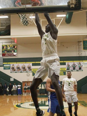 Gallatin's Zyun Mason dunks early in the game against Lebanon on Tues. Jan. 9, 2018.  Photo by Dave Cardaciotto 