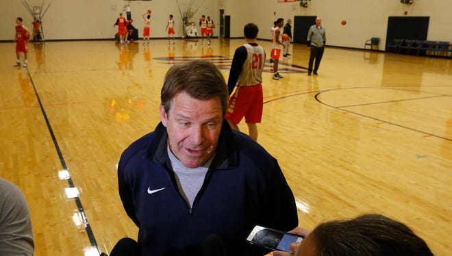 UTEP head basketball coach Tim Floyd shares a couple of minutes with members of the media before putting his team through an early morning practice before boarding a plane to Miama, Florida then a short trip over to Boca Raton, Florida where the Miners will take Florida Atlantic Thursday night in a na attempt to keep their crrent winning streak alive.