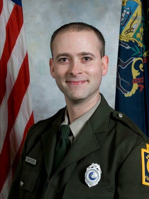 This undated photo provided by the Pennsylvania Game Commission shows 31-year-old Wildlife Conservation Officer David Grove, who was killed in  2010 by a hunter who illegally possessed a gun.