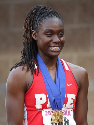Lynna Irby collects a third first place medal after the 200 meter dash during the IHSAA 43rd annual girls track and field state finals, Robert C. Haugh Track and Field Complex at Indiana University, Bloomington, Ind., Friday, June 3, 2016.