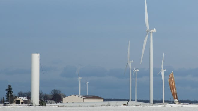 In this photo taken on Thursday, Feb. 25, 2016, an Exelon Corp. wind turbine lies on the ground in Oliver Township just northeast of Pigeon in Huron County, Mich. It fell over during a winter storm that brought wind and heavy snow to much of the state, but the cause of the collapse is unclear. (Jeff Schrier/The Saginaw News via AP) ALL LOCAL TELEVISION OUT; LOCAL TELEVISION INTERNET OUT; MANDATORY CREDIT  