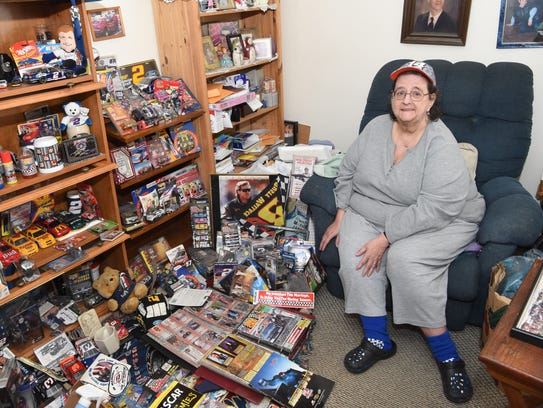 Donna Brunow, 66, sits amid some of her NASCAR memorabilia