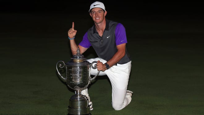 Rory McIlroy of Northern Ireland poses with the Wanamaker trophy after his one-stroke victory during the final round of the 96th PGA Championship at Valhalla Golf Club on August 10, 2014 in Louisville, Kentucky.