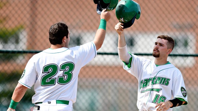 York College's Seth Brosius, left, celebrates with Collin Crowell during a game earlier this season. Brosius and Crowell were both big contributors in a 26-12 slugfest win over Mary Washington on Sunday.