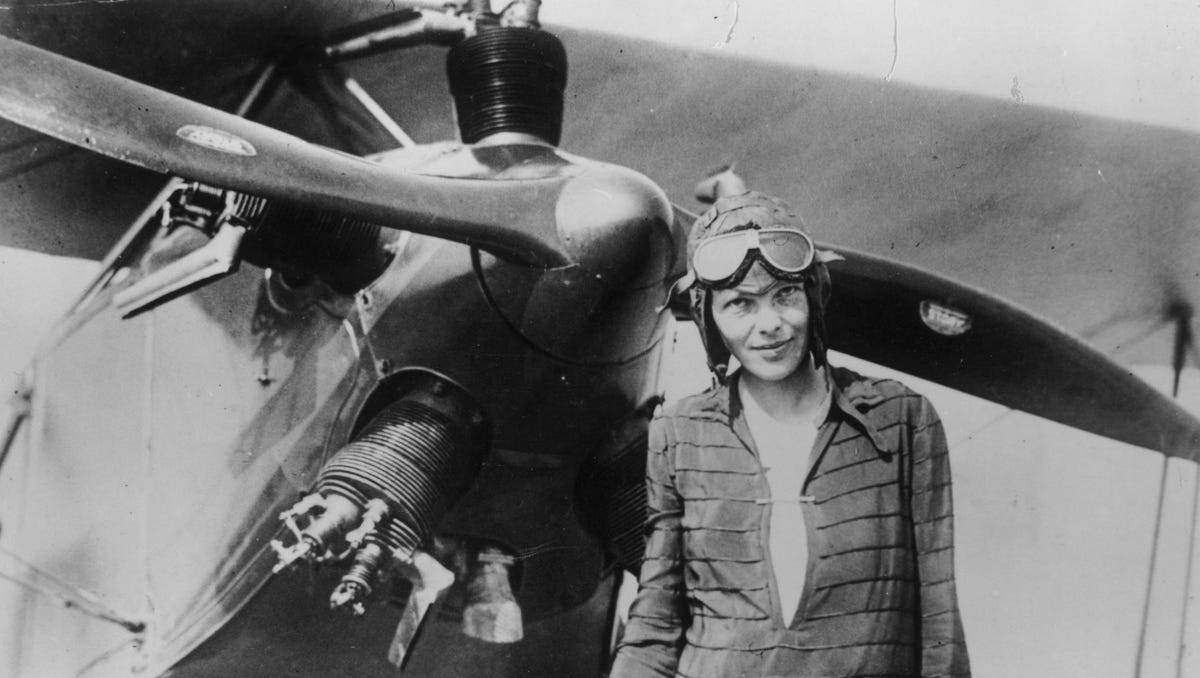Amelia Earhart  in front of her bi-plane called "Friendship" in Newfoundland, June 14, 1928. 
