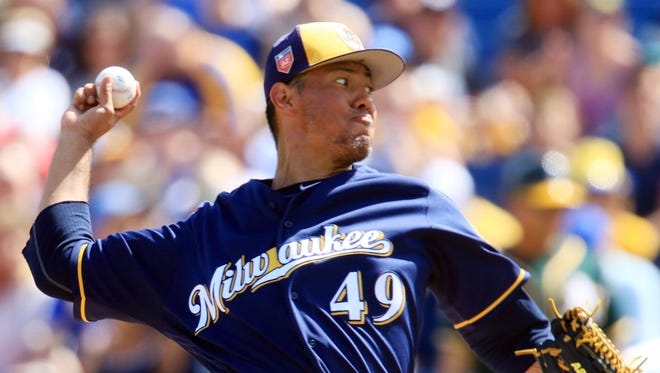 Yovani Gallardo gives up two runs, both coming on a two-run blast by former Brewers Khris Davis in the first inning, on three hits in three innings of work against the Athletics on Friday in a Cactus League game at Maryvale Baseball Park in Phoenix.