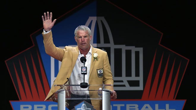 Former Green Bay Packers quarterback Brett says goodbye to the crowd as he completes his speech during NFL Pro Football Hall of Fame Enshrinement Ceremony in Tom Benson Stadium in Canton, Ohio, Saturday, August 6, 2016.