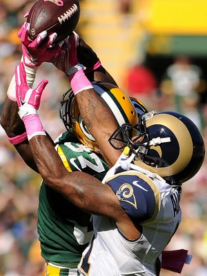 Green Bay Packers cornerback Sam Shields (37) breaks up a pass intended for St. Louis Rams wide receiver Tavon Austin (11) in the second quarter. The Green Bay Packers hosted the St. Louis Rams at Lambeau Field in Green Bay, on Oct. 11.