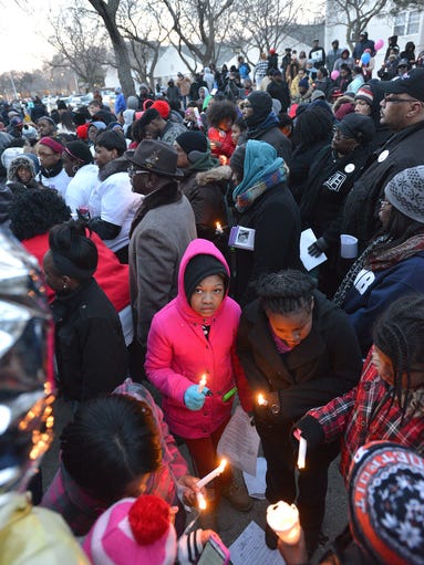 People crowd around each other during the prayer vigil.