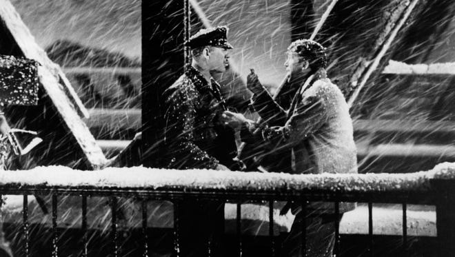 One of the iconic shots of George Bailey, right (Jimmy Stewart), and a police officer from "It's a Wonderful Life."