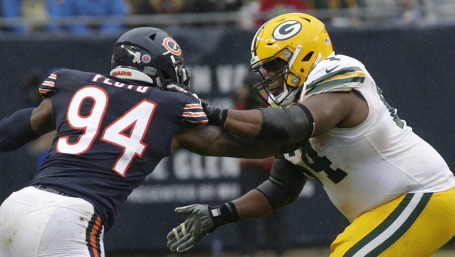 Green Bay Packers offensive guard Justin McCray (64) blocks Chicago Bears outside linebacker Leonard Floyd (94) during the fourth quarter of their game Sunday, November 12, 2017 at Soldier Field in Chicago, Ill. The Green Bay Packers beat the Chicago Bears 23-16.

MARK HOFFMAN/MILWAUKEE JOURNAL SENTINEL