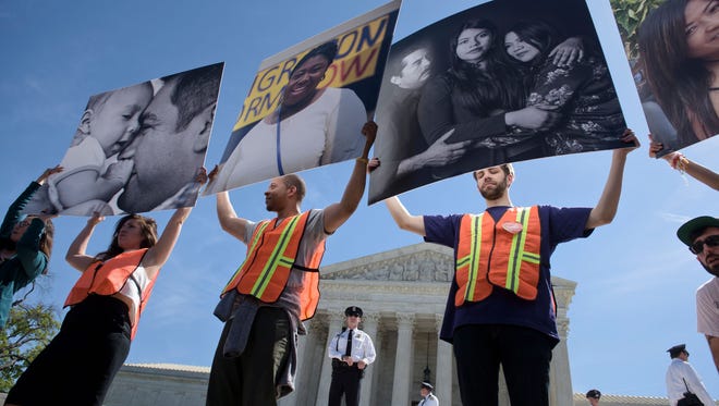 Supporters of immigration reform rally outside the U.S. Supreme Court during arguments in United States vs Texas on Monday. 
Hundreds of protesters rallied Monday outside the court as it weighed a major immigration case that could impact the fate of millions of people facing possible deportation and further raise the stakes in the 2016 White House race.