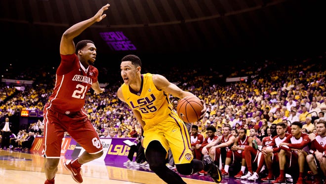 LSU Tigers forward Ben Simmons (25) drives past Oklahoma Sooners forward Dante Buford (21) during the first half of a game at the Pete Maravich Assembly Center.