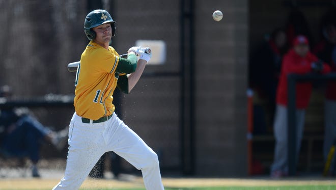 St. Norbert College's Tyler Banovich connects with the ball in the 5th inning. The Knights hosted Ripon College at the Mel Nicks Sports Complex for their home opener in De Pere.