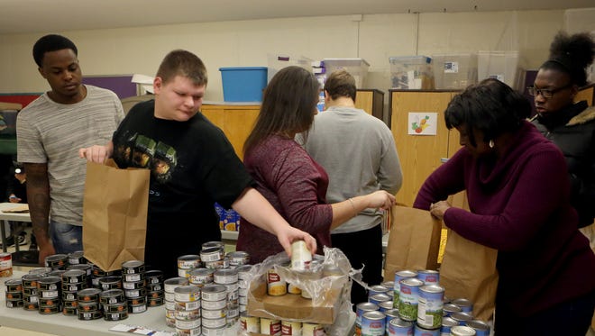 Paul Slattery, 14, along with other BOCES students and staff members, pack donated food to be delivered to other BOCES students whose families are in need at the Hilltop School in Haverstraw Dec. 9, 2016. BOCES students from around Rockland County come to the Hilltop school each Friday to take part in the Backpack Program, which delivers over 150 backpacks filled with food to their fellow students.
