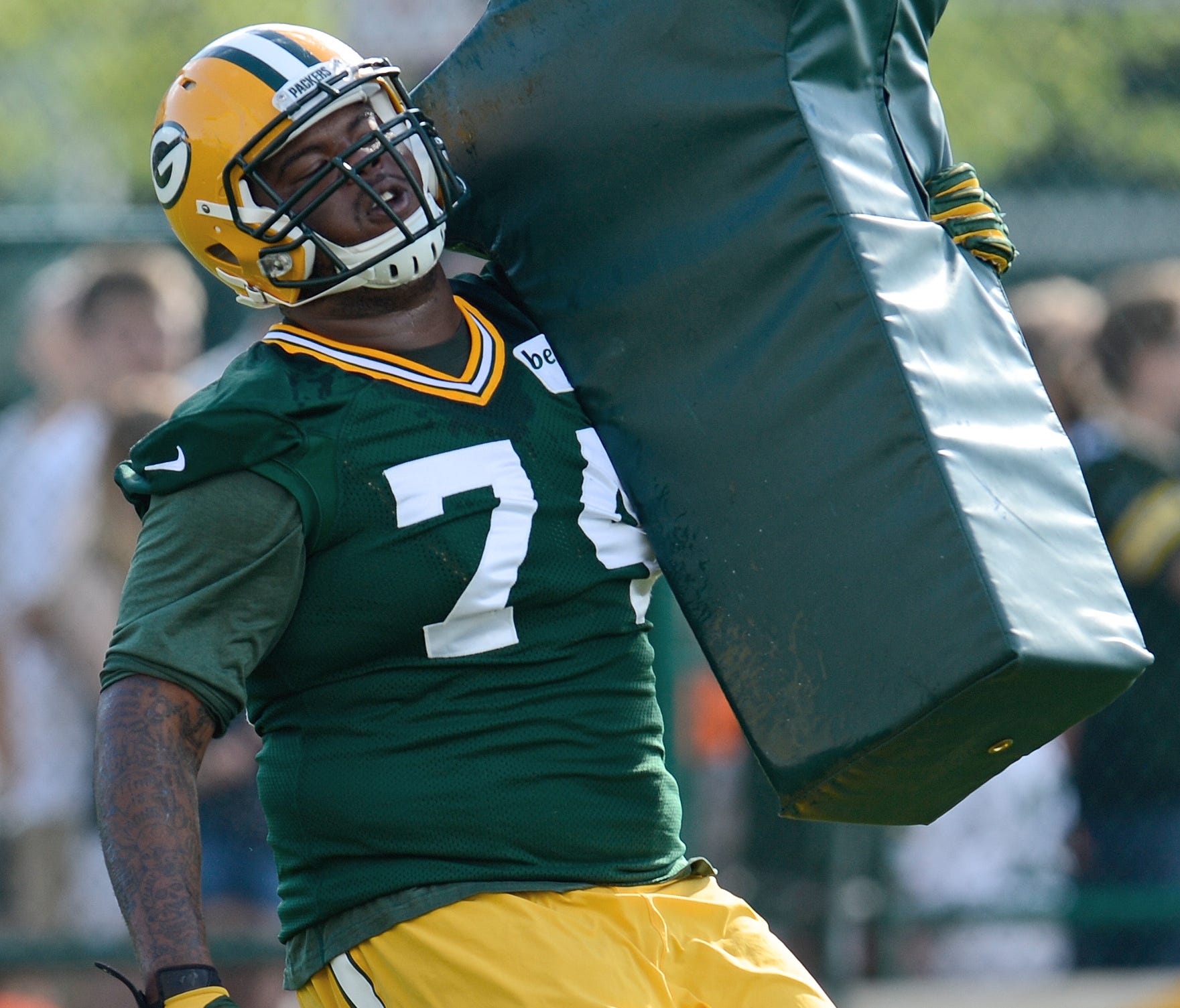 Green Bay Packers defensive end Carlos Gray runs a drill on the second day of Packers 2014 training camp at Ray Nitschke Field in Green Bay.