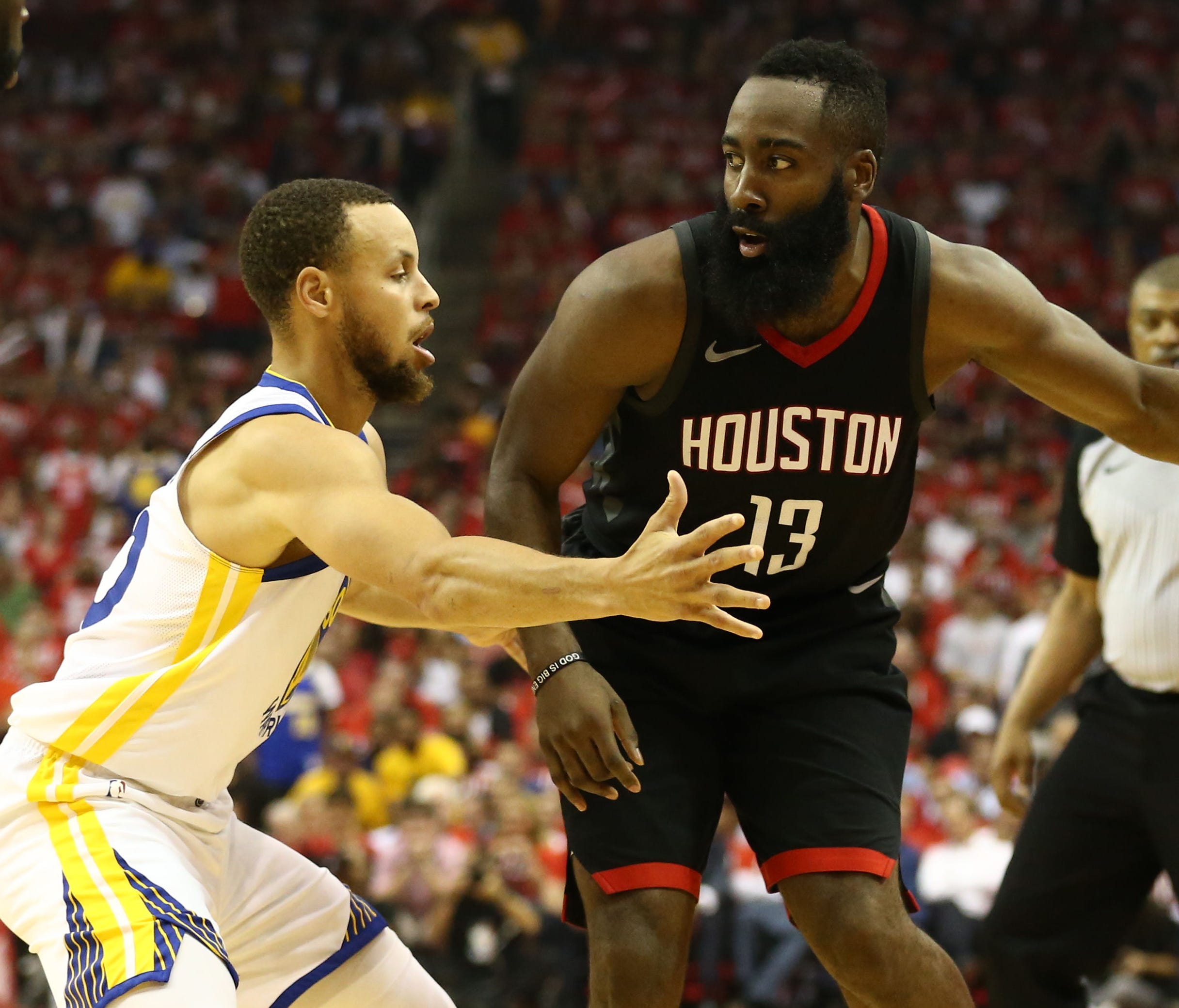 Houston Rockets guard James Harden (13) dribbles against Golden State Warriors guard Stephen Curry (30) during the second quarter in Game 1 of the Western Conference finals.