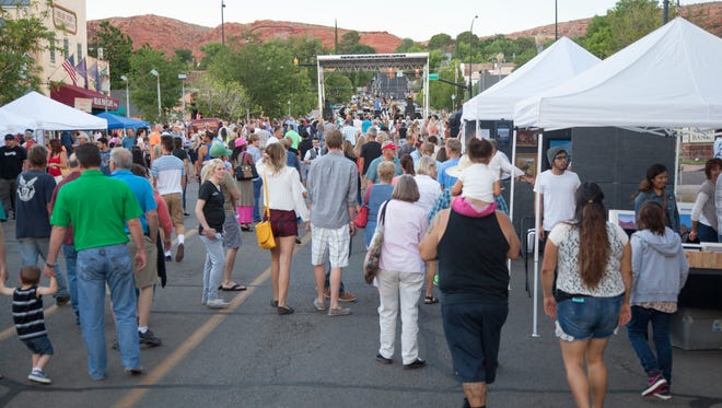 Members of the St. George community enjoy the first George Streetfest Friday, June 5, 2015.