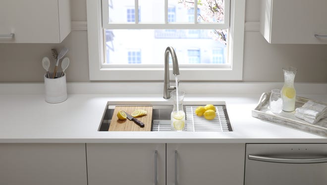 Touchless control on Kohler's Sensate faucet keeps hands free and saves water.