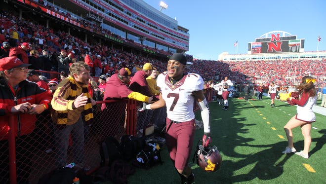 Damarius Travis, a Pensacola High grad, exchanges handshakes with Minnesota Gophers fans during a game earlier in his collegiate career. He will play for the East squad in Saturday's East West Shine Game in St. Petersburg