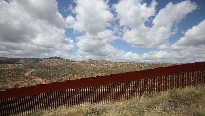Presidential candidate Donald Trump wants to replace this fence with a 50-foot wall made of concrete.