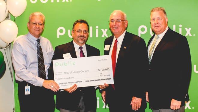 Bob Betchel, Publix Vice President of Retail Operations – Miami Division, Keith Muniz, president/CEO of ARC of Martin County, Chuck White,  ARC of Martin County board member and Tim Redding, Publix Regional Director at check presentation ceremony.