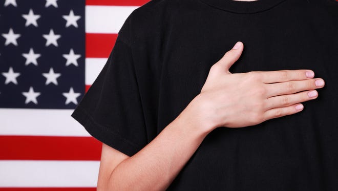 A teacher in Colorado is being investigated after she was accused of assaulting a student for not standing for the Pledge of Allegiance.