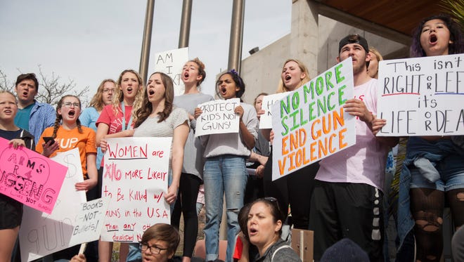 Members of the community, led by DSU students, participate in the March For Our Lives demonstration Saturday, March 24, 2018. Hundreds of participants marched from the DSU campus to the St. George City office.