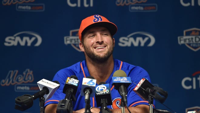 Tim Tebow addresses media during a press conference Tuesday afternoon at First Data Field in Port St. Lucie before his first game as a player for the St. Lucie Mets. XAVIER MASCAREÑAS/TCPALM