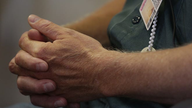 Daniel Frisch has his hands folded as he is interviewed at the Fox Lake Correctional Institution.