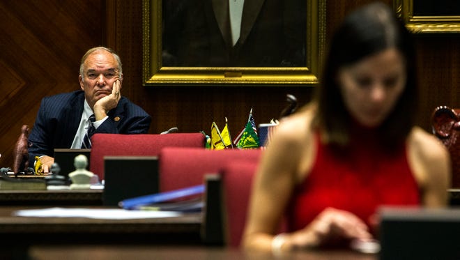 Rep. Don Shooter waits before a vote on whether to remove him from office on Thursday, Feb. 1, 2018, at the Arizona House of Representatives chambers in Phoenix. Rep. Michelle Ugenti-Rita is seen in the foreground.