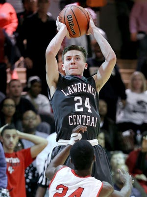 Lawrence Central guard Kyle Guy takes a shot to possibly win the game in overtime over Park Tudor's Brent Brimmage in Wednesday night's game held at Park Tudor High School on Dec. 17, 2014. Guy missed the shot and Park Tudor held on to win 57-56 in overtime.