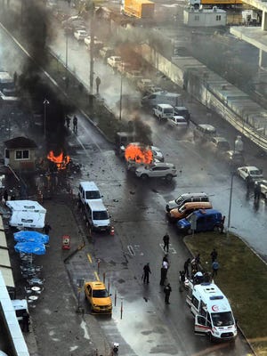 Cars burn after a car bomb explosion in Izmir, Turkey, on Jan. 5.