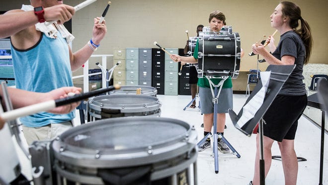 Drummers with Central's Spirit of Muncie marching band work on their timing Thursday, July 21, 2016, while preparing for their Saturday competition.