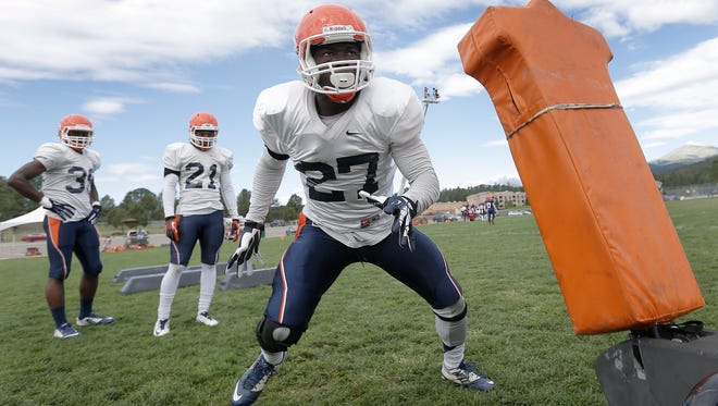 UTEP junior safety Devin Cockrell goes through drills during Thursday’s practice at Camp Ruidoso along with teammates Kolbi McGary, back left, and Dashone Smith, center. 