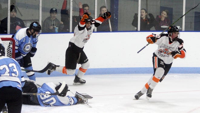 Mamaroneck's Will Payne, right, celebrates after scoring again during a varsity hockey game against Suffern at Hommocks Park Ice Rink in Larchmont Jan. 29, 2016. Mamaroneck defeated Suffern 4-2.