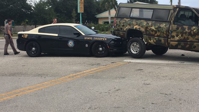 A Florida Highway Patrol cruiser became wedged under the rear of a pickup Saturday in the 5700 block of U.S. 1 in Indian River County.