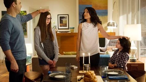 This image released by Bravo shows Paul Adelstein, from left, Conner Dwelly, Lisa Edelstein, and Dylan Schombing in a scene from "Girlfriends' Guide to Divorce," Bravo's first original scripted series, premiering Dec. 2.