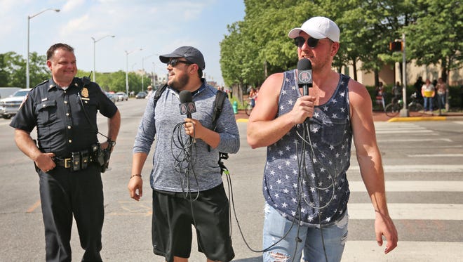 Former Colts punter Pat McAfee, right, shows up to film for his show, during the Poor People's Campaign protest that blocked Capitol Ave. at Ohio St., Monday, May 14, 2018.  He introduced himself as Peyton Manning.  The protest was part of a national, 38-state revival of a 1968 movement by Martin Luther King.  Thirteen people were arrested in the protest because they blocked the street.