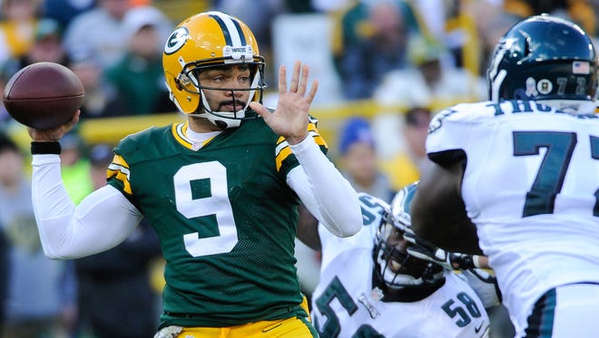 QB Seneca Wallace was knocked out of his first start with the Packers.