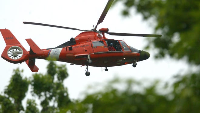 A Coast Guard helicopter like this one was involved in the search for missing boaters off the Brigantine coast this weekend.