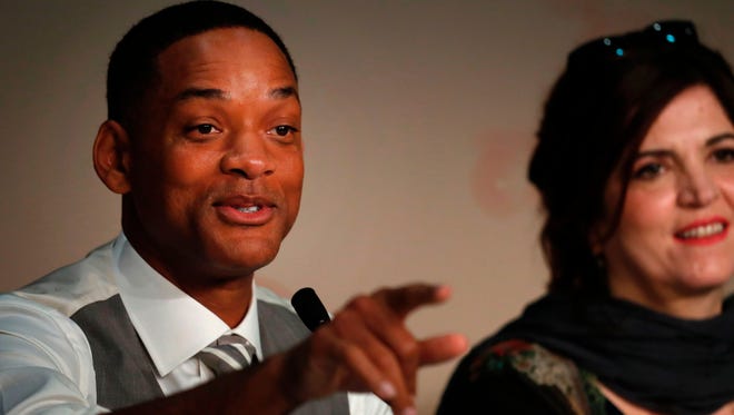 Will Smith, left, and French actress and writer Agnes Jaoui attend a press conference at Cannes Film Festival Wednesday.