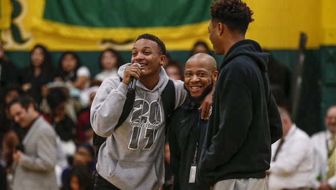 Crispus Attucks Tigers' Teyon Scanlan speaks to his fellow students during a school pep rally on Monday, April 3, 2017, in honor of the Attucks' varsity boys basketball team's recent state championship victory.