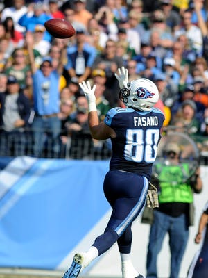 Titans tight end Anthony Fasano (80) hauls in a touchdown pass against the Packers last season.