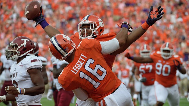 Clemson defensive lineman Christian Wilkins (42) celebrates with tight end Jordan Leggett (16) after catching a touchdown pass against Troy during the 4th quarter on Saturday, September 10, 2016 at Clemson's Memorial Stadium. 