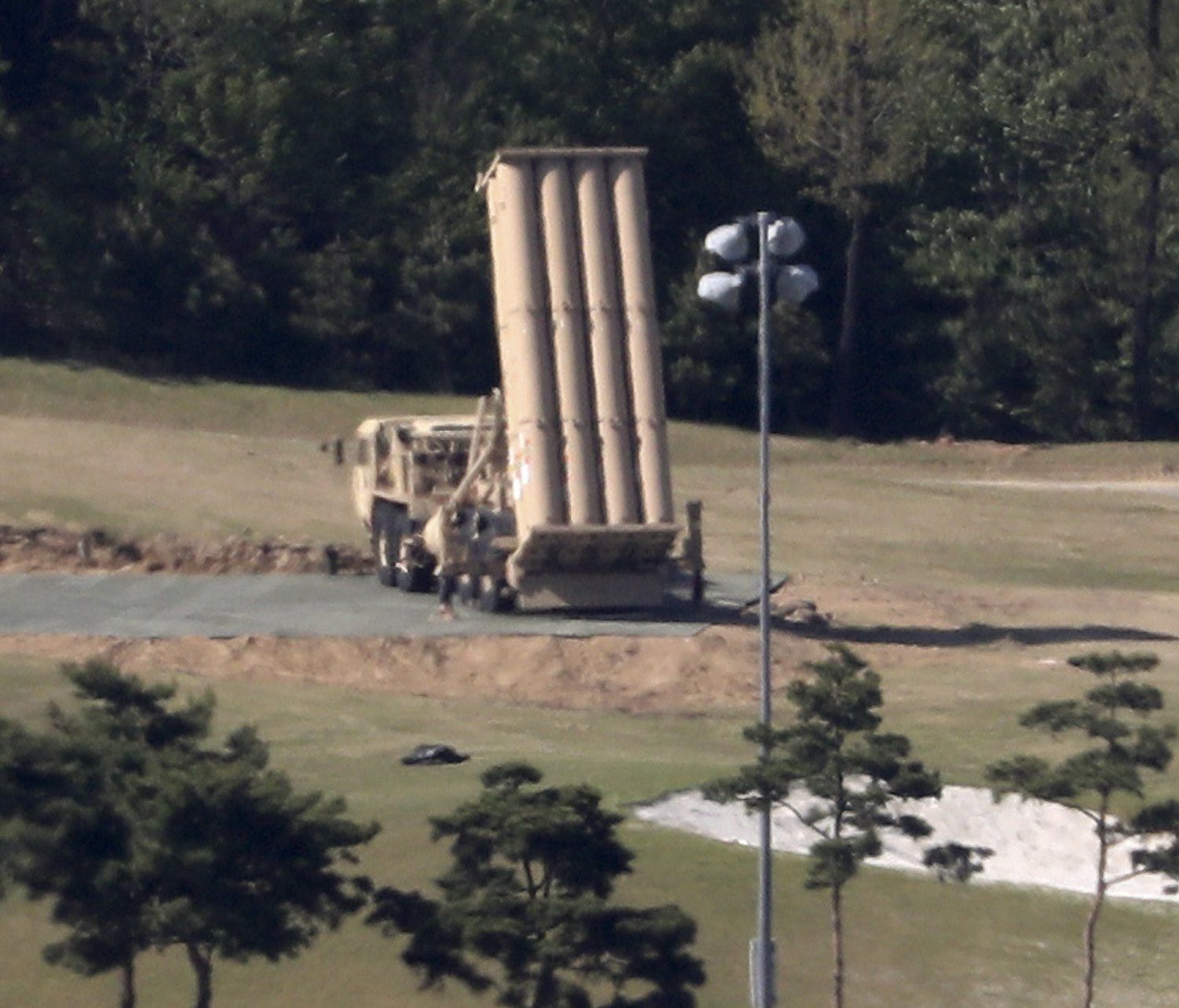 (FILE) - A Terminal High Altitude Area Defense (THAAD) launcher sits at a golf course in Seongju, some 300km southeast of Seoul, South Korea, May 1, 2017.