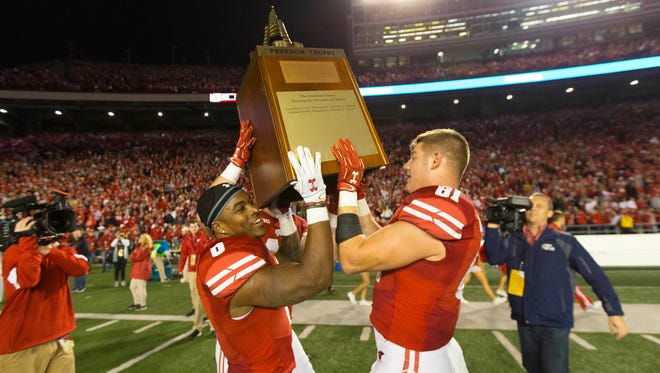 Oct 29, 2016; Madison, WI, USA;  Wisconsin Badgers running back Corey Clement (6) and tight end Troy Fumagalli (81) lift the Freedom Trophy following the game against the Nebraska Cornhuskers at Camp Randall Stadium.  Wisconsin won 23-17.  Mandatory Credit: Jeff Hanisch-USA TODAY Sports